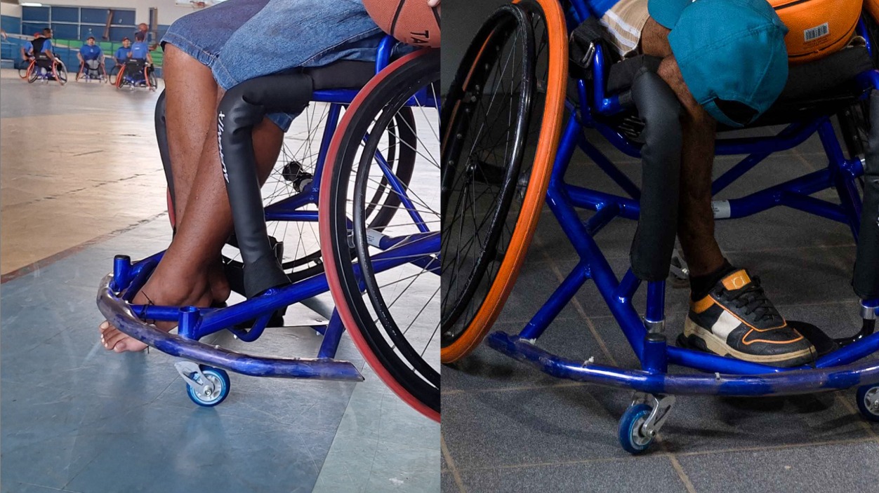 Foto colorida mostra um grupo diverso de atletas paralímpicos e apoiadores reunidos em uma sala do Centro de Referência Paralímpico de Roraima. Alguns estão em cadeiras de rodas, com bolas de basquete e tênis de mesa. Ao fundo, há banners e uma grande faixa azul na parede com o nome do centro. Foto colorida mostra um grupo diverso de atletas paralímpicos e apoiadores reunidos em uma sala do Centro de Referência Paralímpico de Roraima. Alguns estão em cadeiras de rodas, com bolas de basquete e tênis de mesa. Ao fundo, há banners e uma grande faixa azul na parede com o nome do centro.